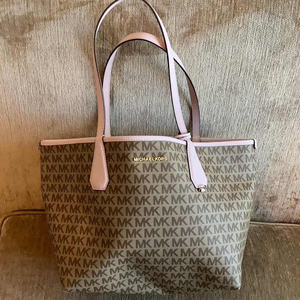 Large Michael Kors bag with mini clutch.